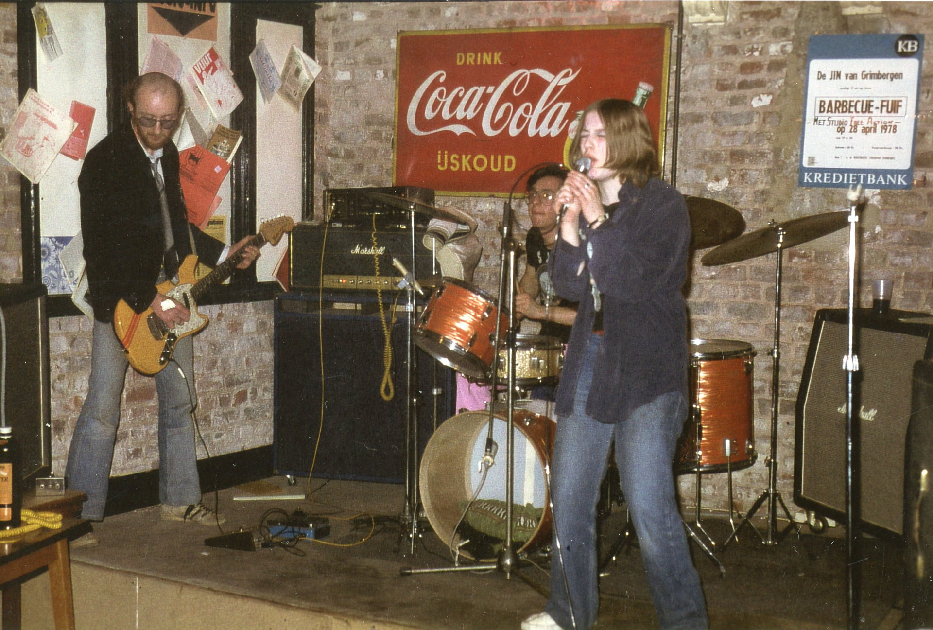 Band playing a youth-club stage under a Coca-Cola sign, Grimbergen 1978
